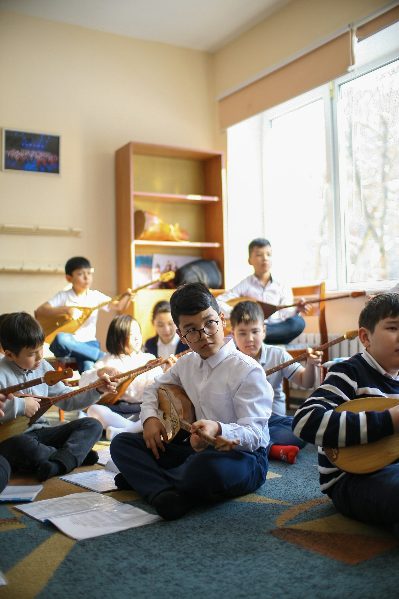 A classroom of kids playing music together